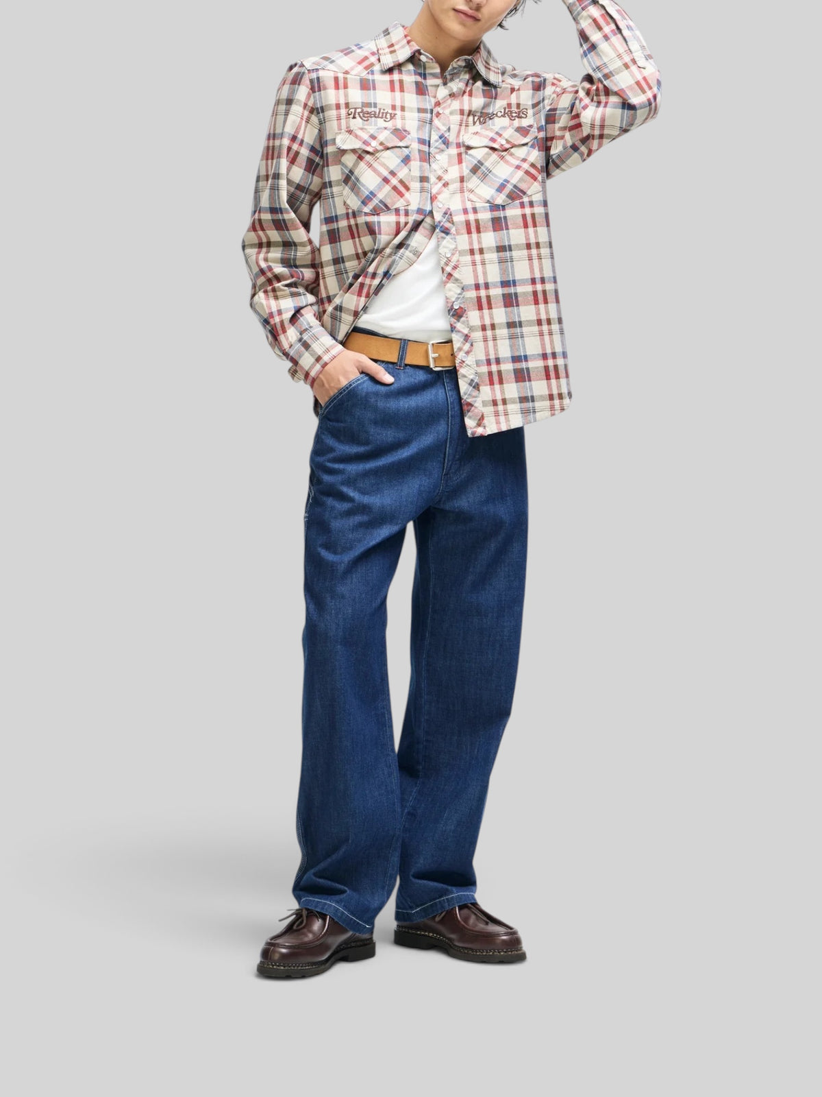 Baffle Haus Reality Wreckers natural check cotton shirt with embroidered chest art and snap buttons on a male model