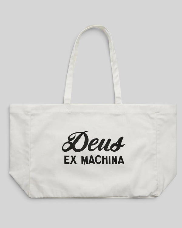 Baffle Haus natural cotton twill tote bag featuring a black Deus Ex Machina logo print and twin shoulder straps.