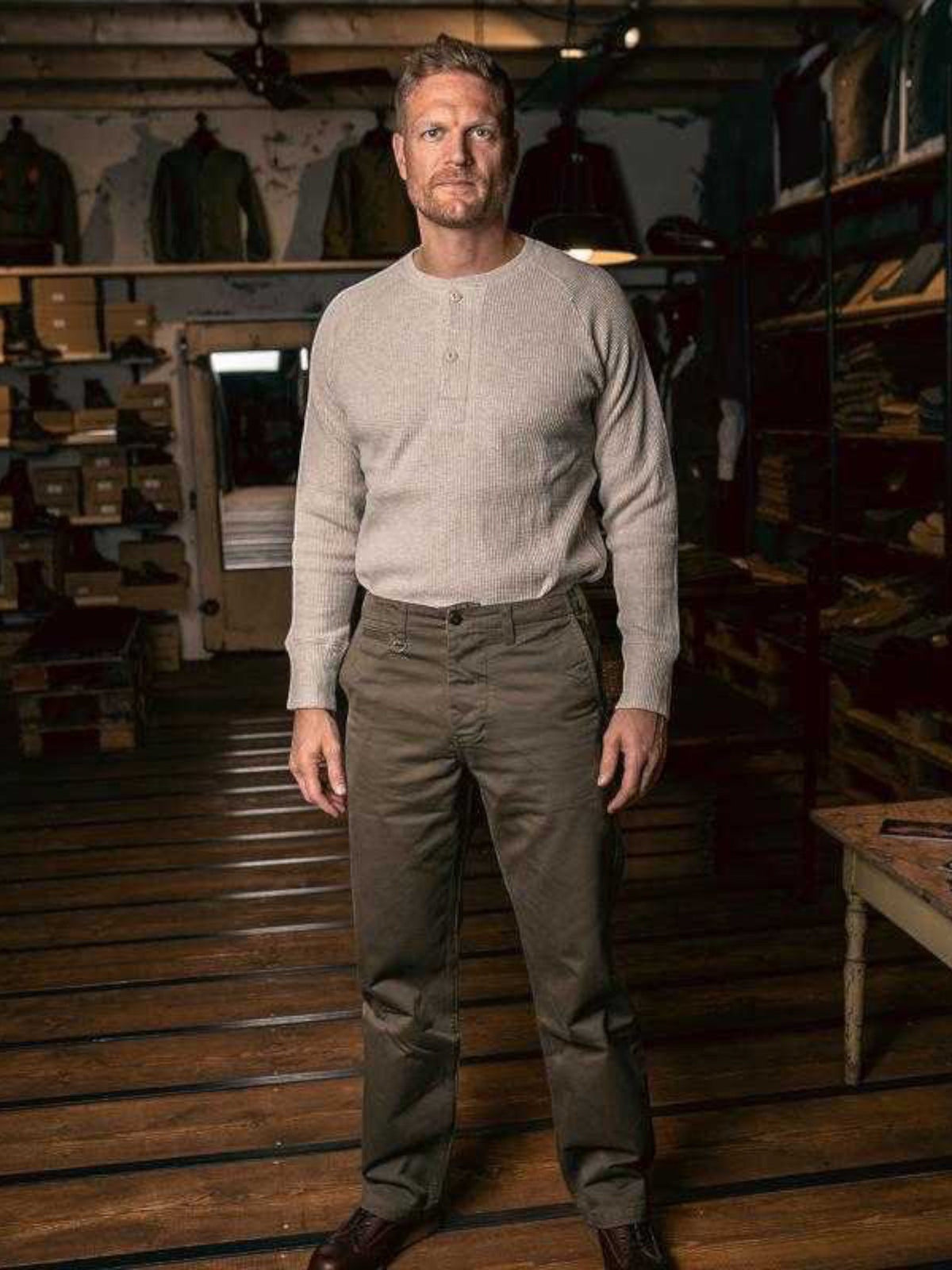 Baffle Haus 1936 natural heavyweight cotton waffle knit shirt with button front detail worn by a man in a shop