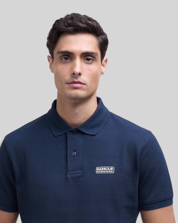 Baffle Haus Barbour International navy blue cotton pique polo shirt with ribbed collar and chest logo badge