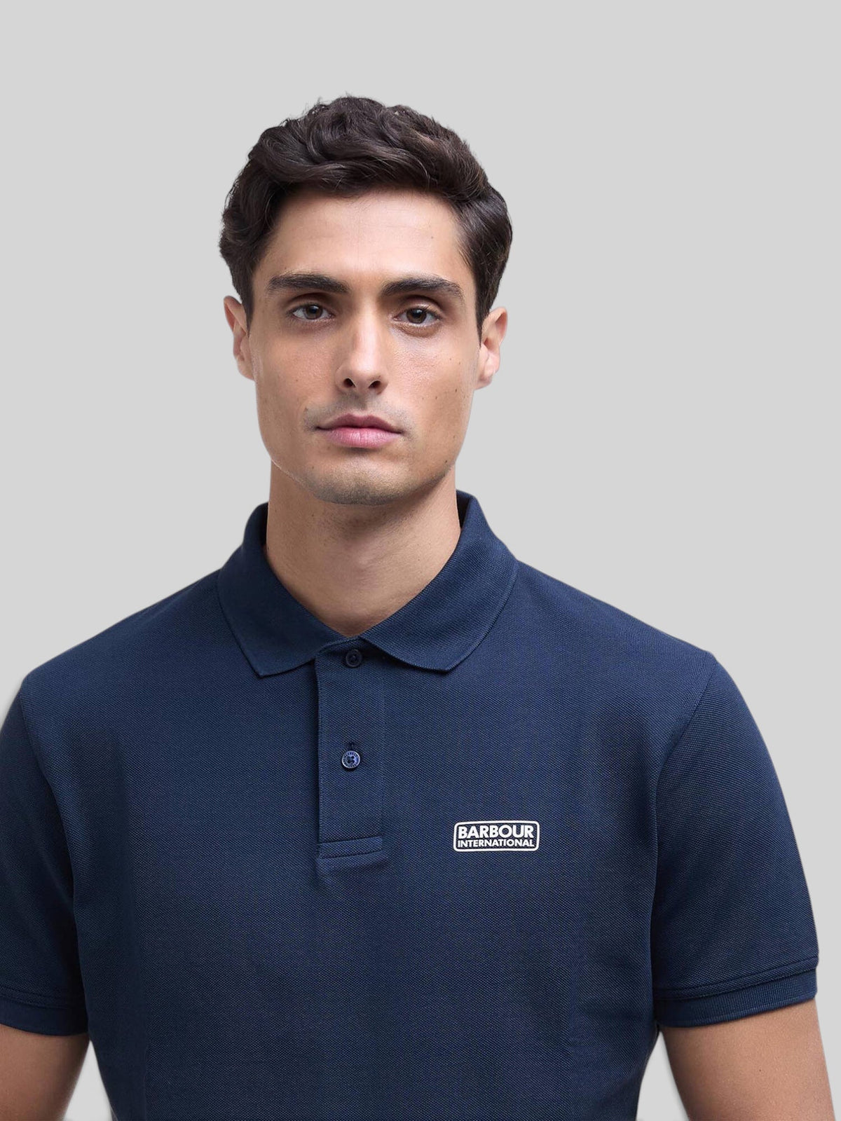 Baffle Haus Barbour International navy blue cotton pique polo shirt with ribbed collar and chest logo badge