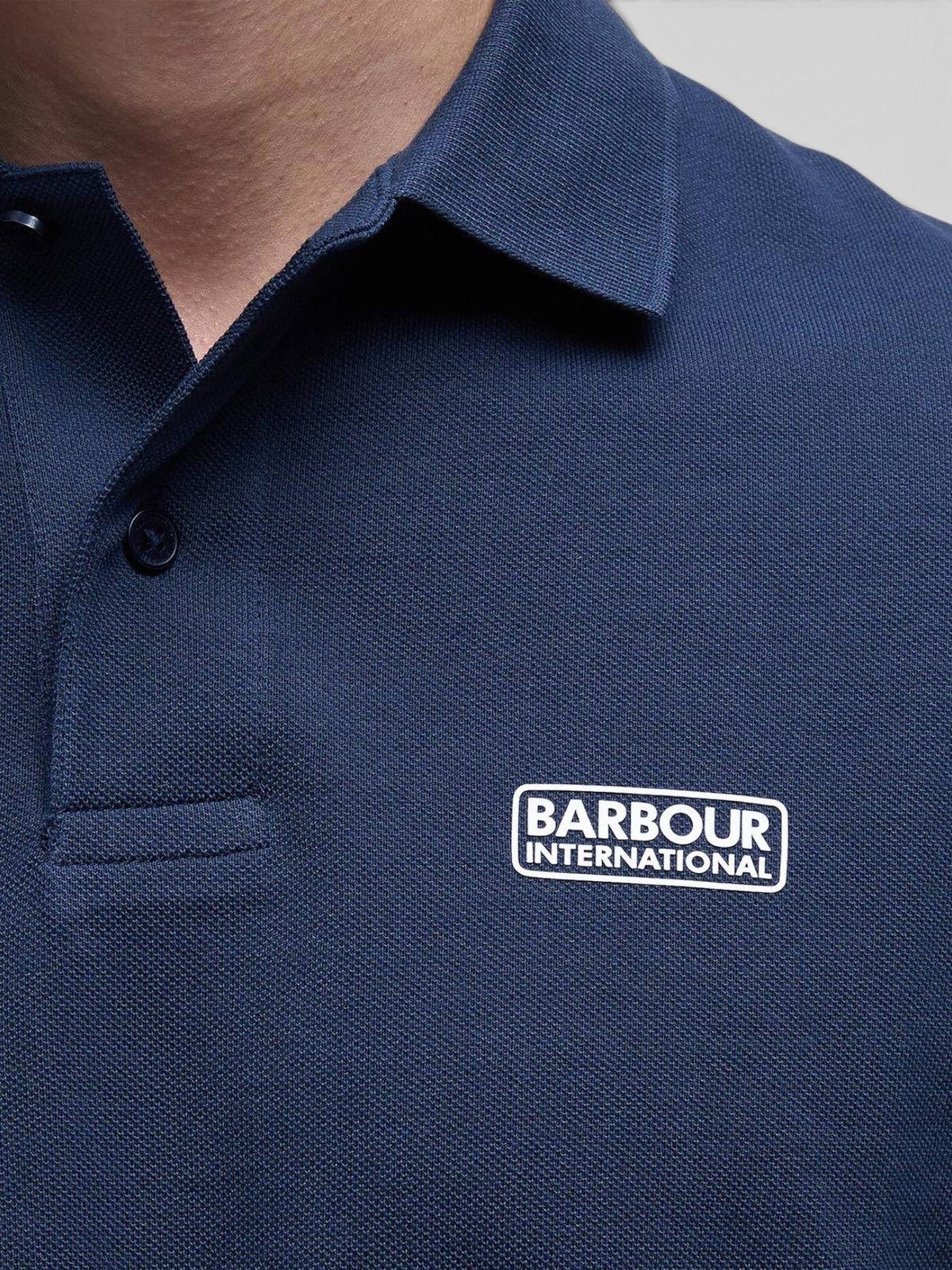 Baffle Haus Barbour International navy blue cotton pique polo shirt with ribbed collar and chest logo badge