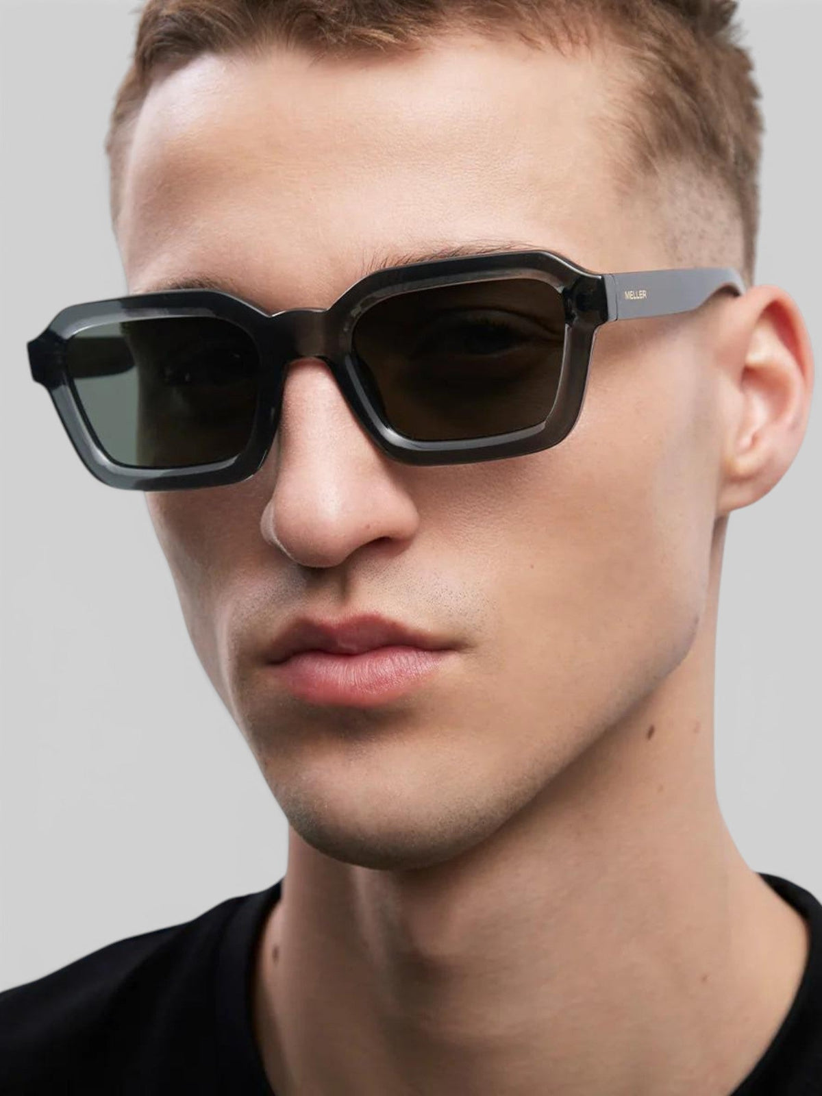 Baffle Haus NAYAH sunglasses in fossil olive bio acetate with squared frames and polarized lenses on a male model