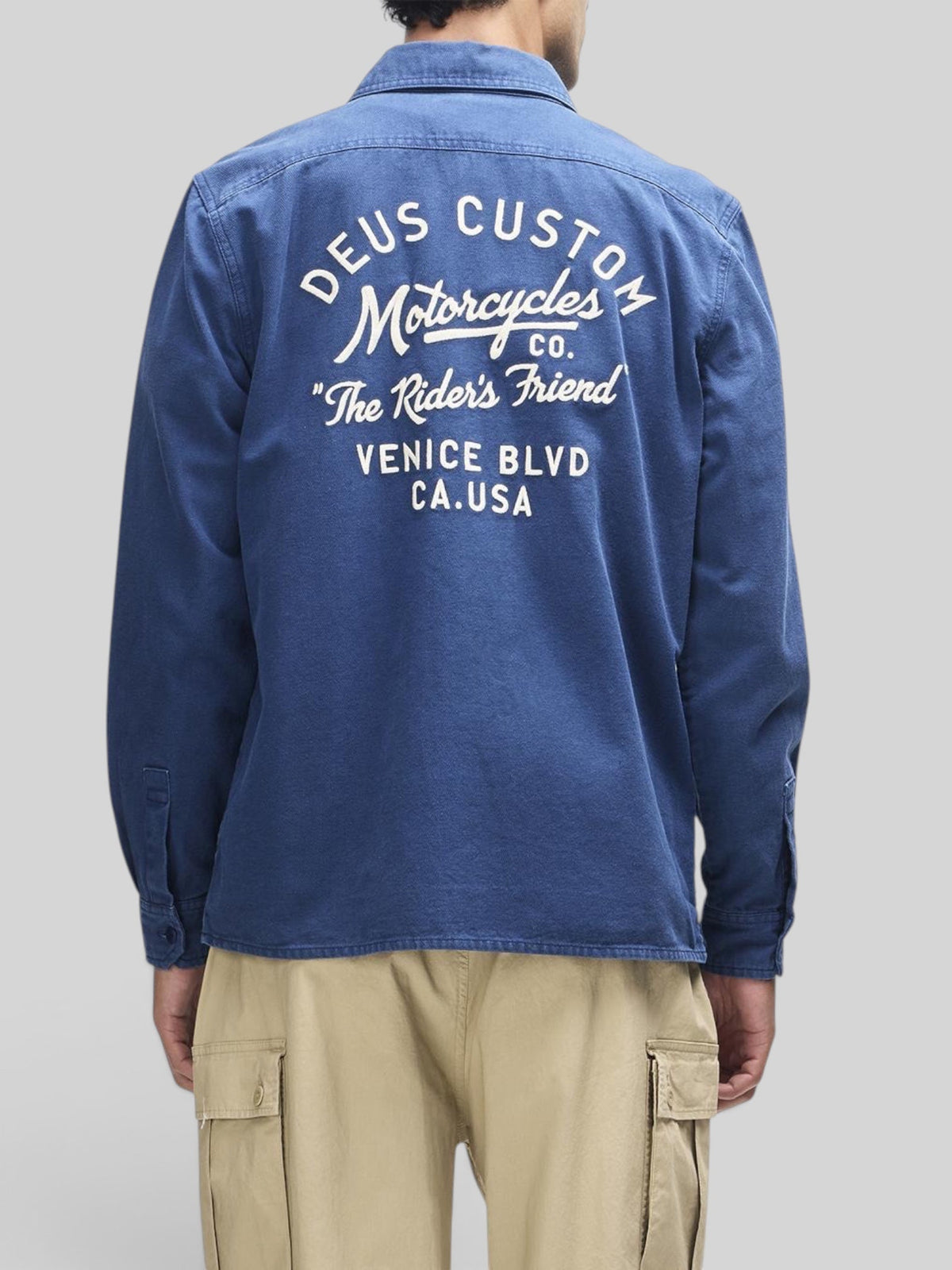 Baffle Haus Nomad mechanic blue cotton twill overshirt with white embroidered Deus motorcycle back graphic