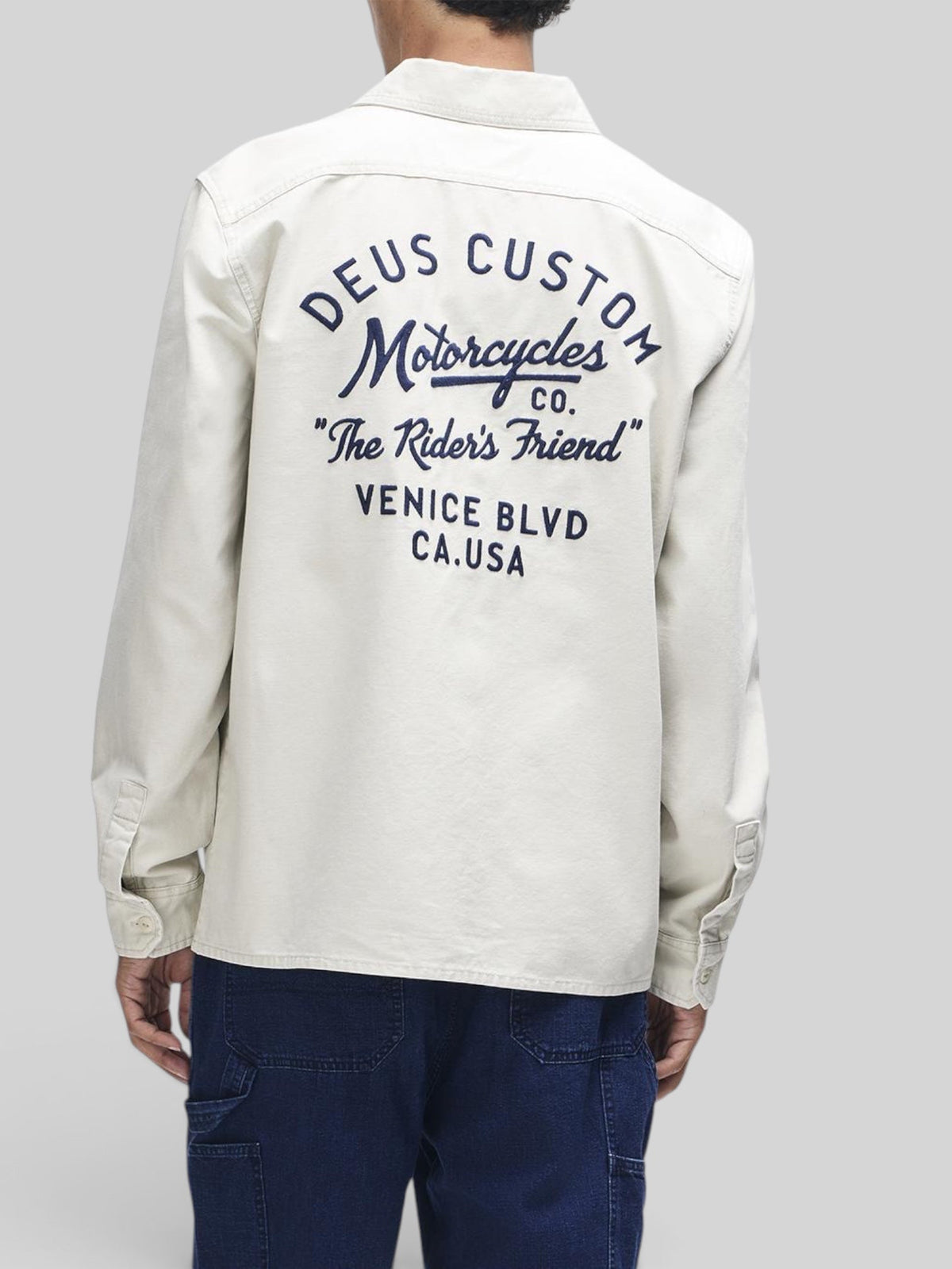 Baffle Haus Nomad shirt in dirty white cotton twill with Deus Custom Motorcycles embroidery on the back