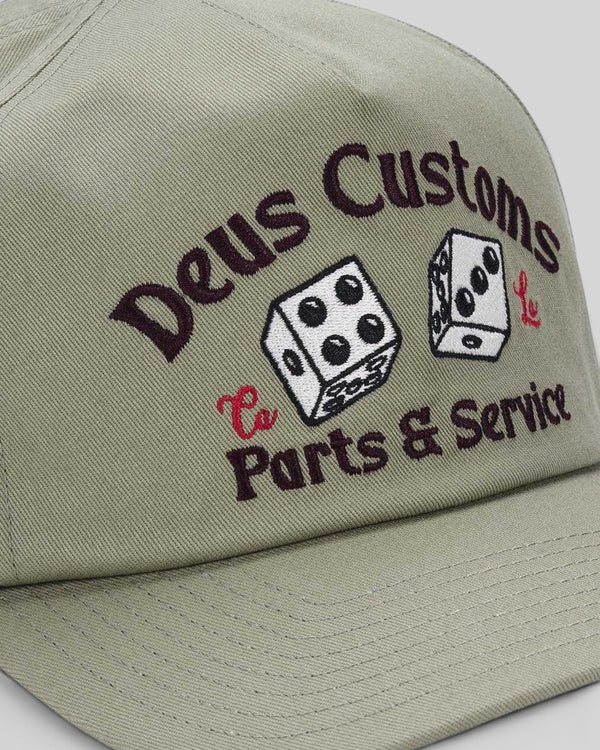 Baffle Haus Knucklebones cap in olive green cotton twill with vintage-inspired dice embroidery on the front panel.