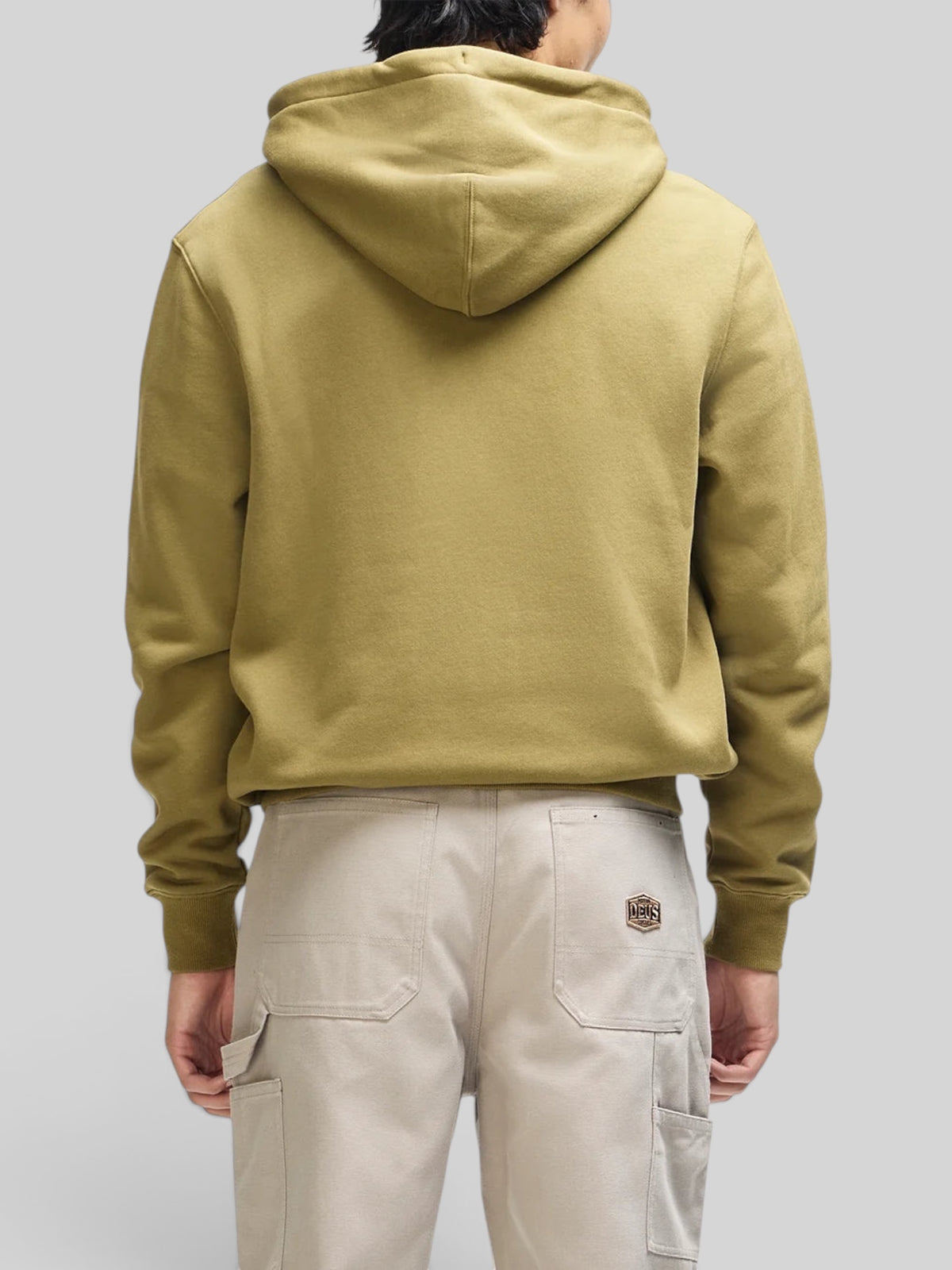 Baffle Haus Victory Lap olive green zip hoodie with a boxy fit and ribbed cuffs, viewed from the back on a model.
