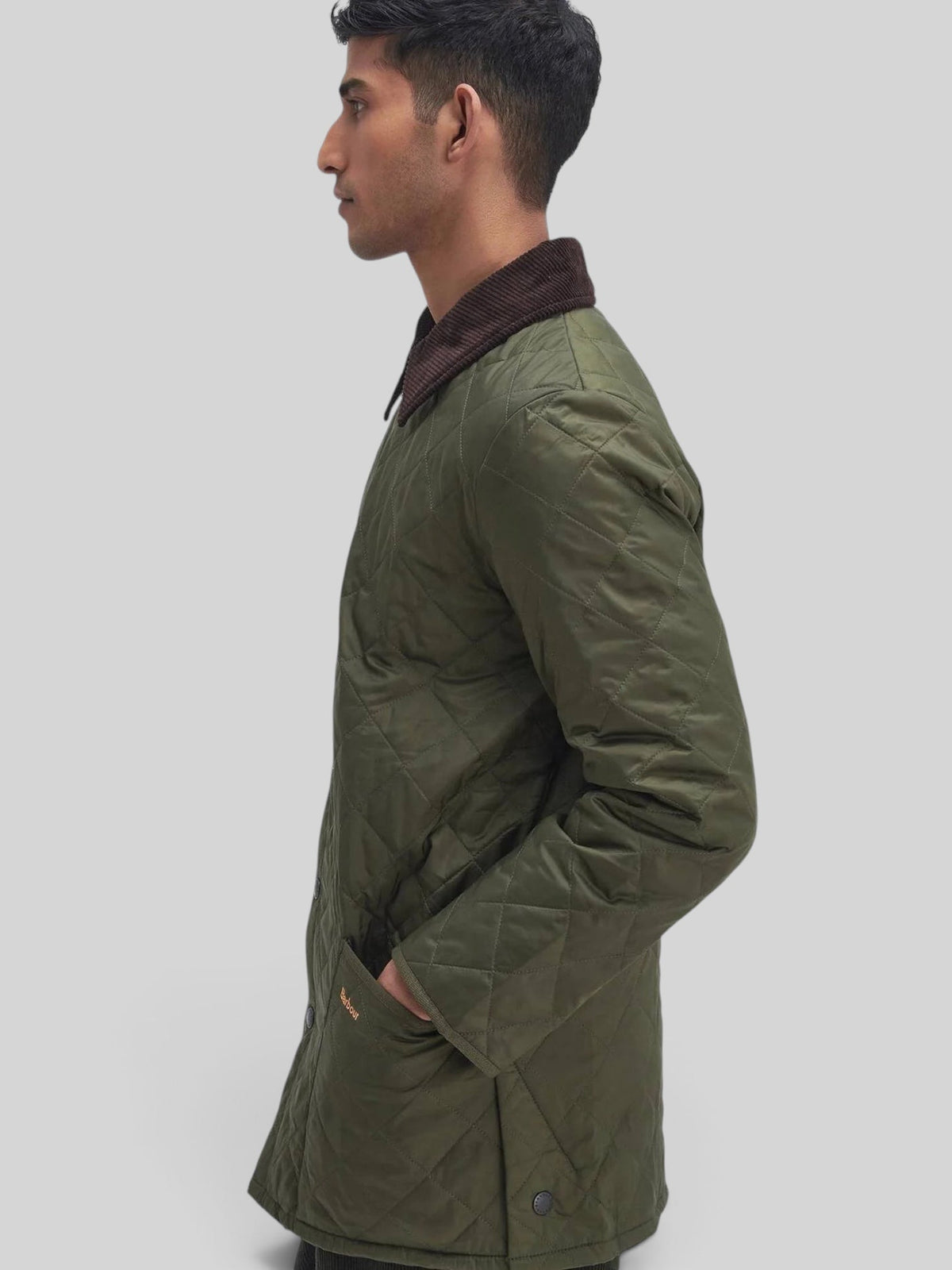 Baffle Haus Heritage Liddesdale olive quilted jacket with diamond pattern, corduroy collar, and snap-close front.