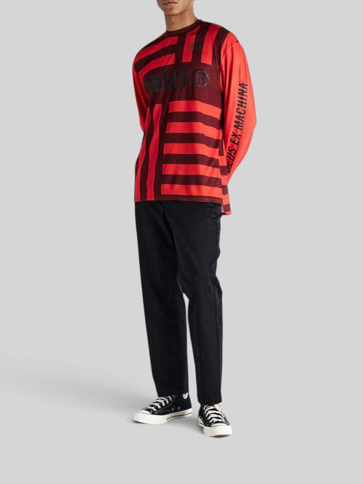 Baffle Haus Blackout Moto Jersey in orange and black with long sleeves and Deus Ex Machina graphic branding