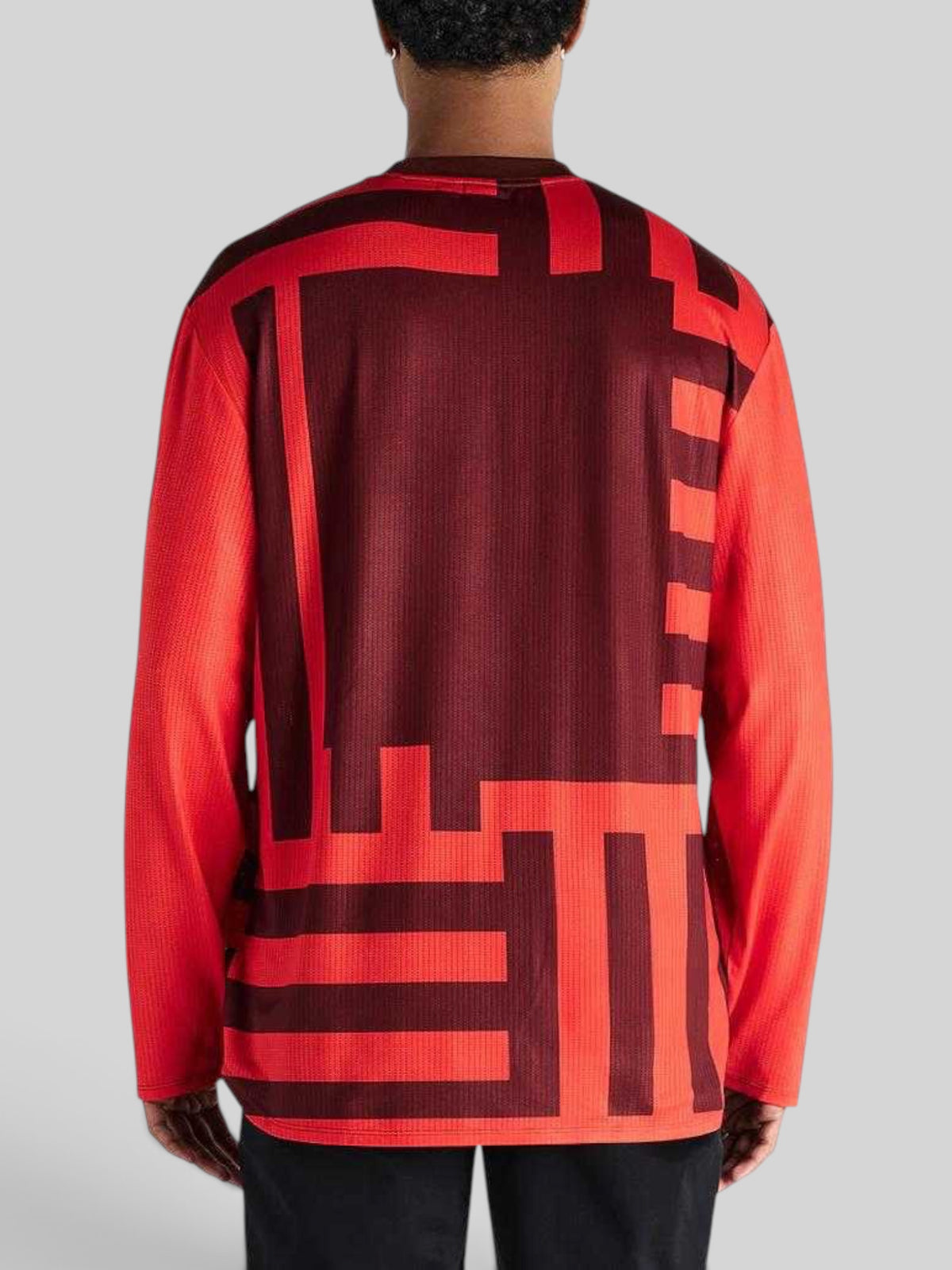 Back view of Baffle Haus Blackout Moto Jersey in orange and dark red with geometric graphic print on mesh fabric