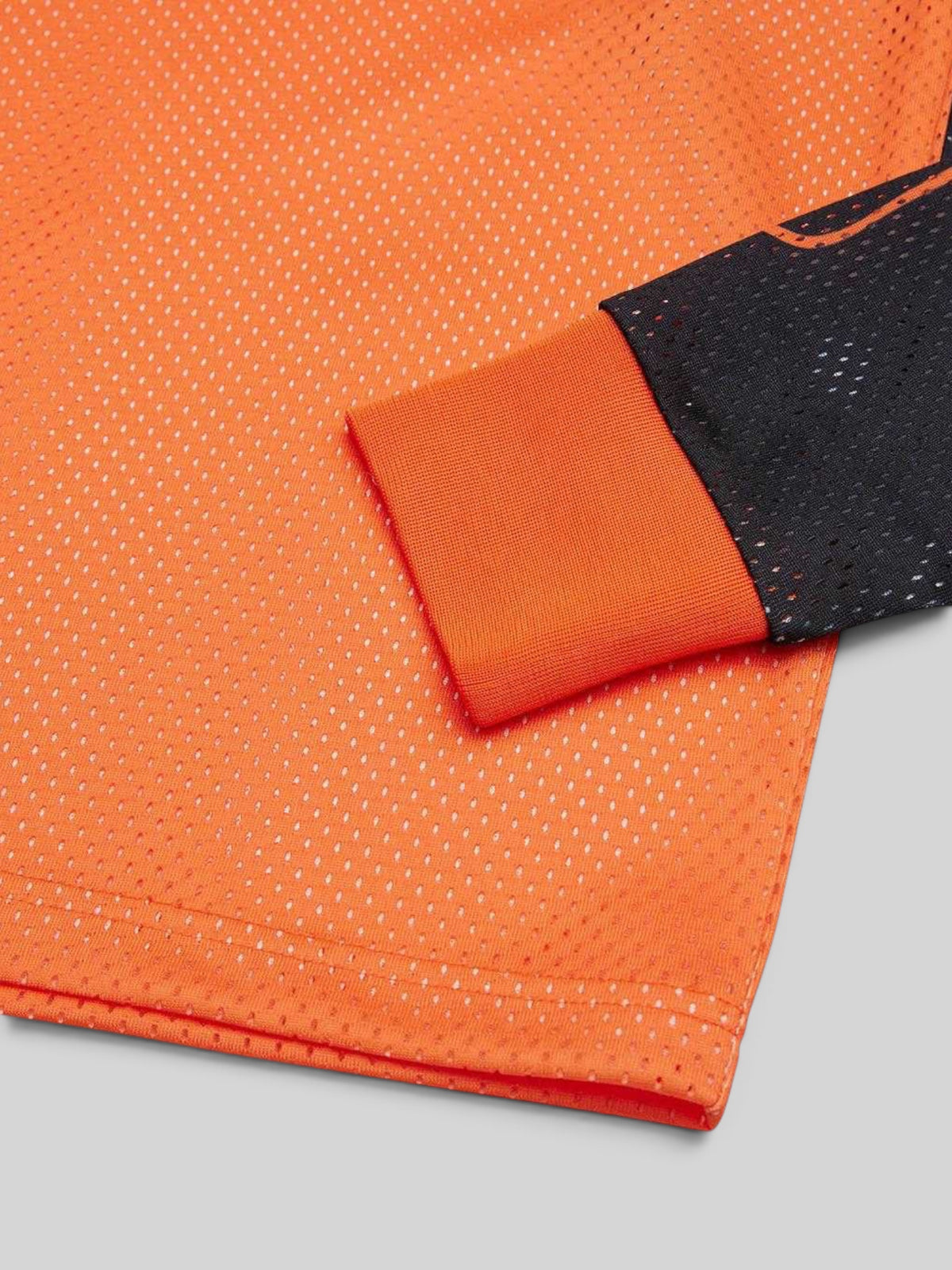 Baffle Haus Replay Moto Jersey in golden poppy orange polyester mesh with black sleeve detail and ribbed cuff