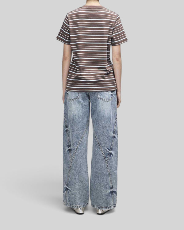 Baffle Haus Pierre stripe tee in java brown and baby blue cotton worn with wide-leg denim jeans, back view