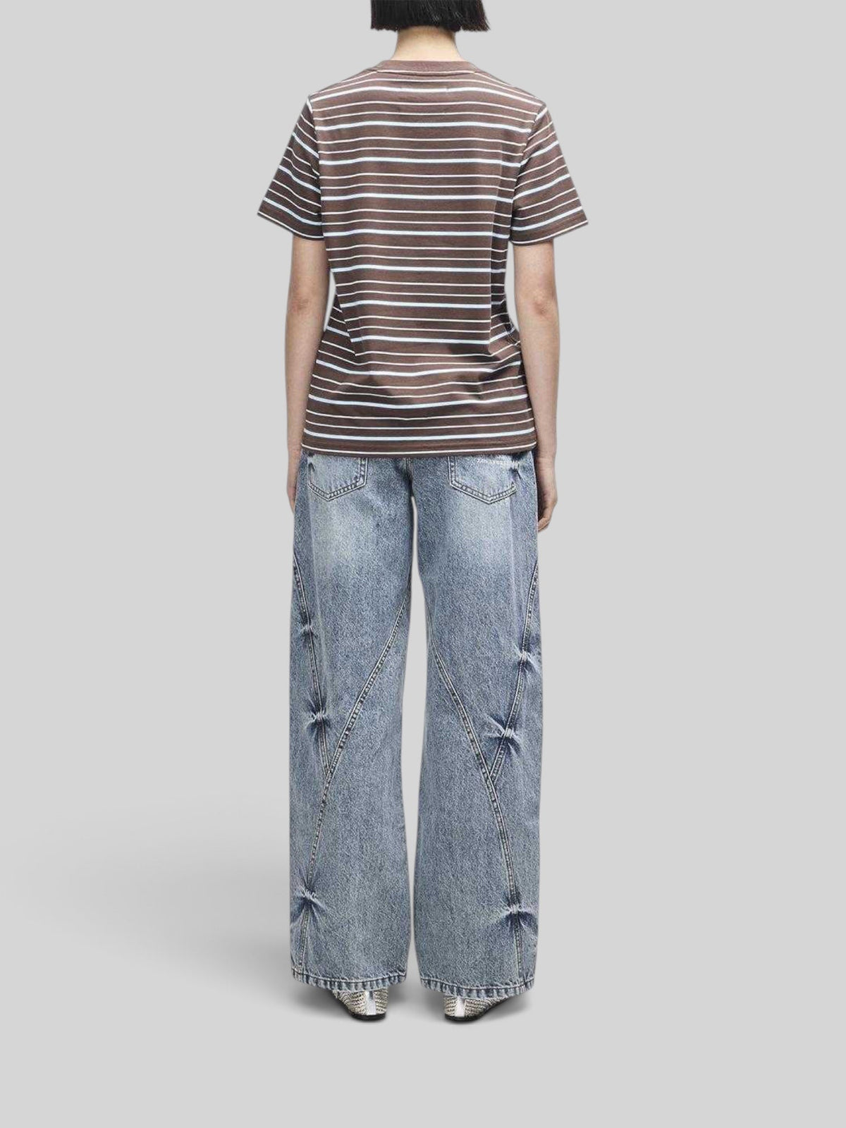 Baffle Haus Pierre stripe tee in java brown and baby blue cotton worn with wide-leg denim jeans, back view