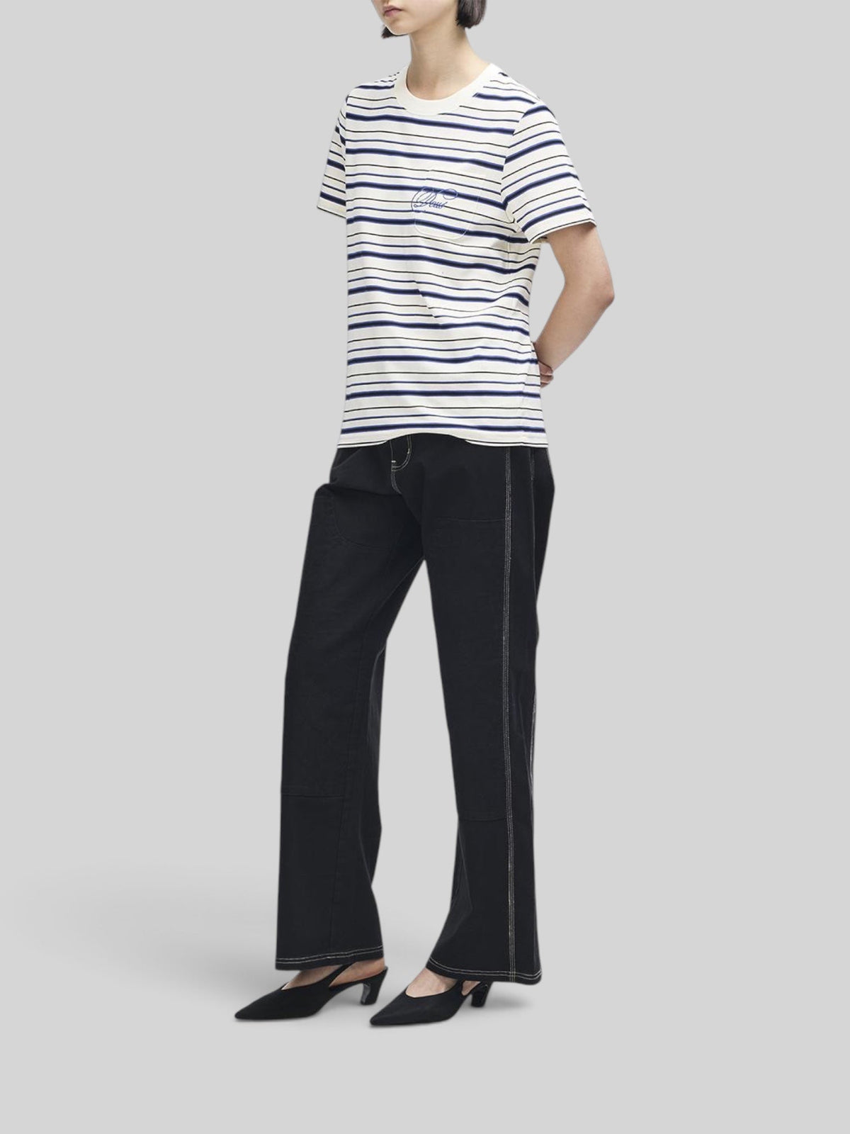Baffle Haus Pierre stripe tee in cream and blue with contrast embroidery on the chest pocket, worn by a model.