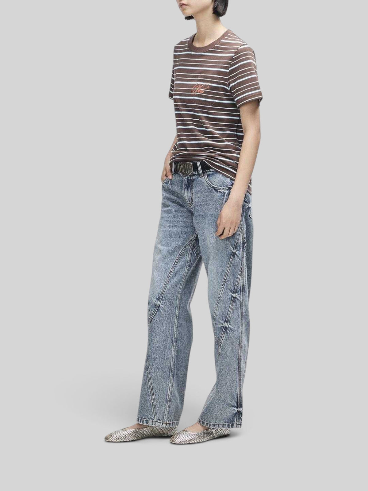 Baffle Haus Pierre stripe tee in java brown and baby blue with chest pocket and embroidery, worn with blue jeans