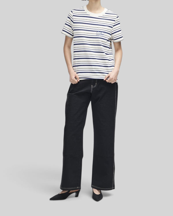 Baffle Haus Pierre stripe tee in cream and blue cotton with a chest pocket and contrast embroidery on a model