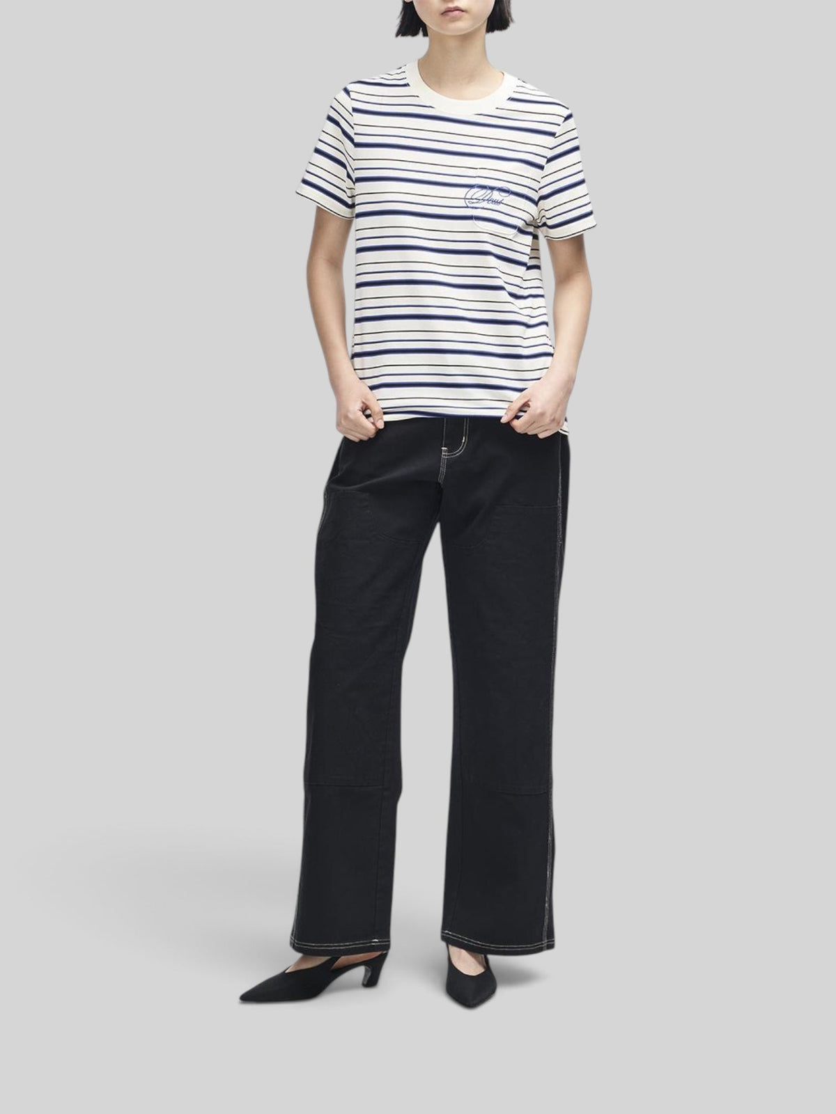 Baffle Haus Pierre stripe tee in cream and blue cotton with a chest pocket and contrast embroidery on a model