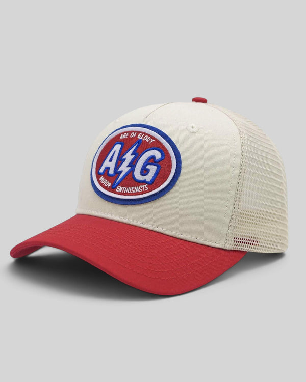 Baffle Haus Pilot cap in white and red with a vintage racing team patch, mesh back, and snapback closure.