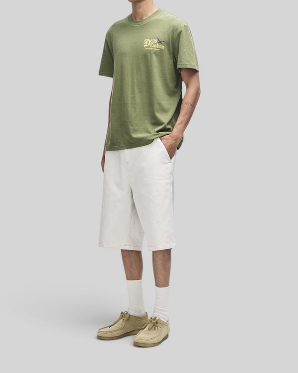Baffle Haus Beep-Beep Tee in pine green with chest graphic, boxy fit, made from recycled cotton and polyester blend.