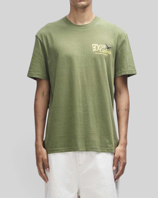 Baffle Haus Beep-Beep Tee in pine green, a box-fit short sleeve t-shirt with Deus Customs graphic print on the chest.