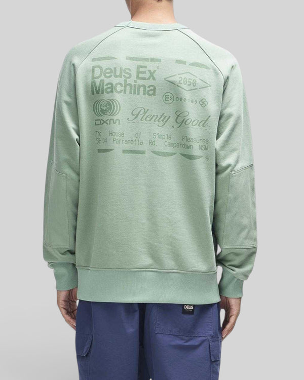 Baffle Haus Plenty Good crew neck fleece in loden frost green with back graphic print and nylon sleeve panels.