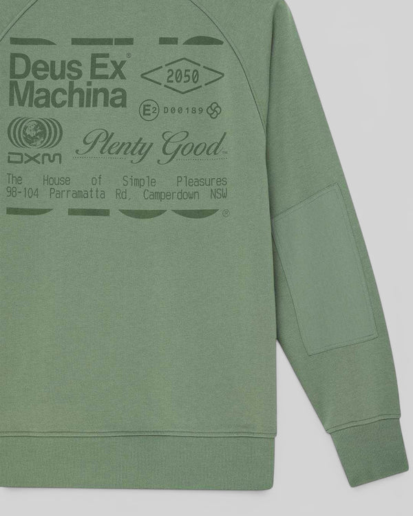 Baffle Haus Plenty Good crew neck fleece in loden frost green with chest graphic and nylon ripstop sleeve panel