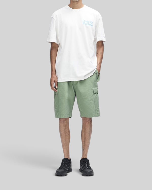 Baffle Haus Plenty Good Tee in vintage white with chest graphic, worn with sage green cargo shorts and black sneakers
