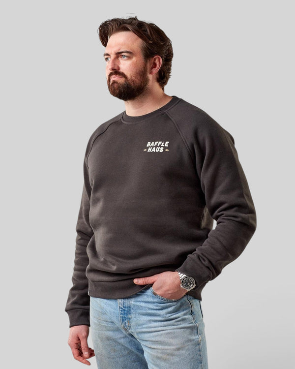 Baffle Haus Coffee & Motors sweatshirt in printers ink grey, featuring a crew neck and small chest logo on a model.