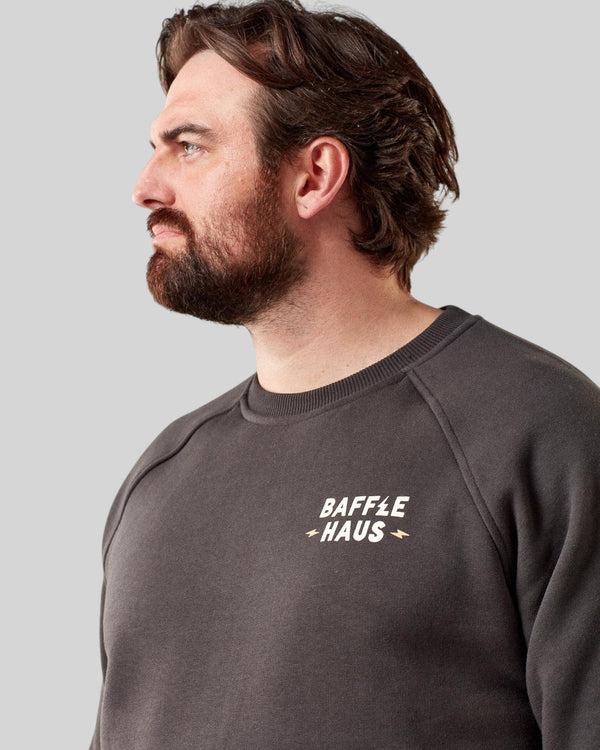 Baffle Haus Coffee & Motors sweatshirt in printers ink grey, featuring a crew neck and chest logo on a male model.