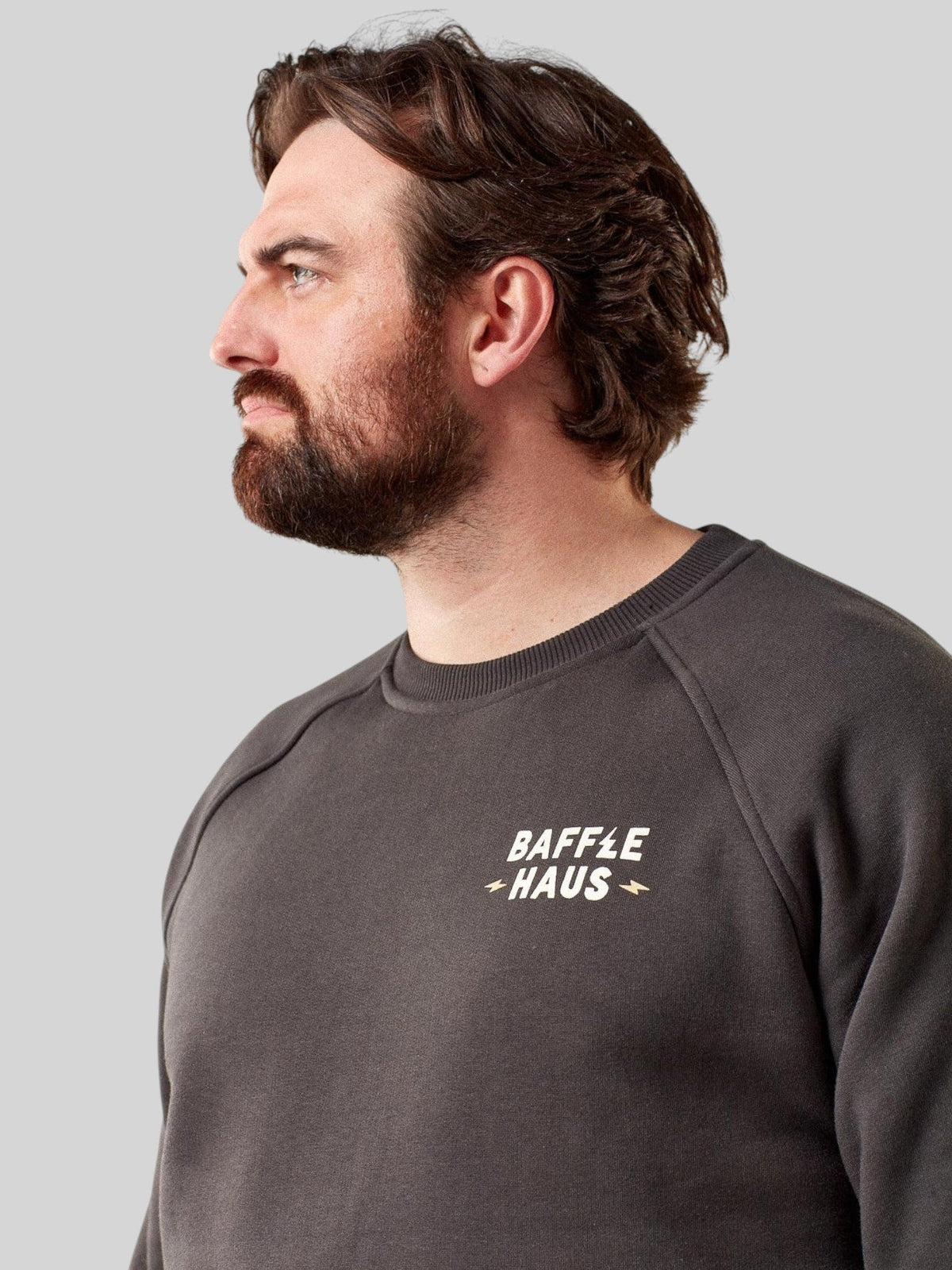 Baffle Haus Coffee & Motors sweatshirt in printers ink grey, featuring a crew neck and chest logo on a male model.