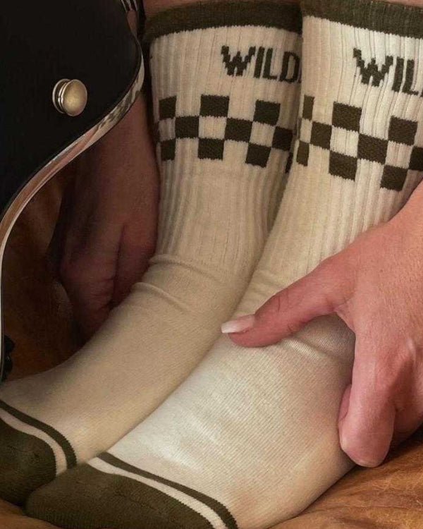 Baffle Haus race green and ecru double-fleece socks with a checkered pattern and Wild text detail