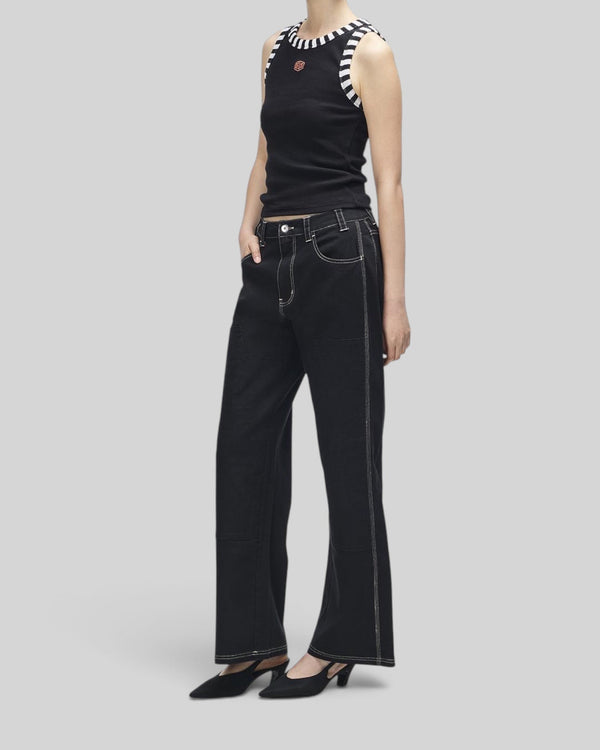 Baffle Haus Rally Shield black ribbed tank top with contrast striped neck and armhole trim worn by a model