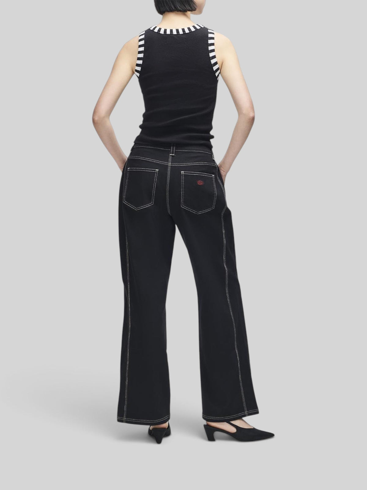 Baffle Haus Rally Shield black ribbed tank top with striped trim worn with black contrast stitch trousers