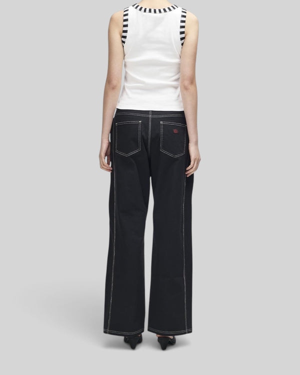 Baffle Haus Rally Shield Tank in antique white with contrast striped trim worn with black wide-leg trousers