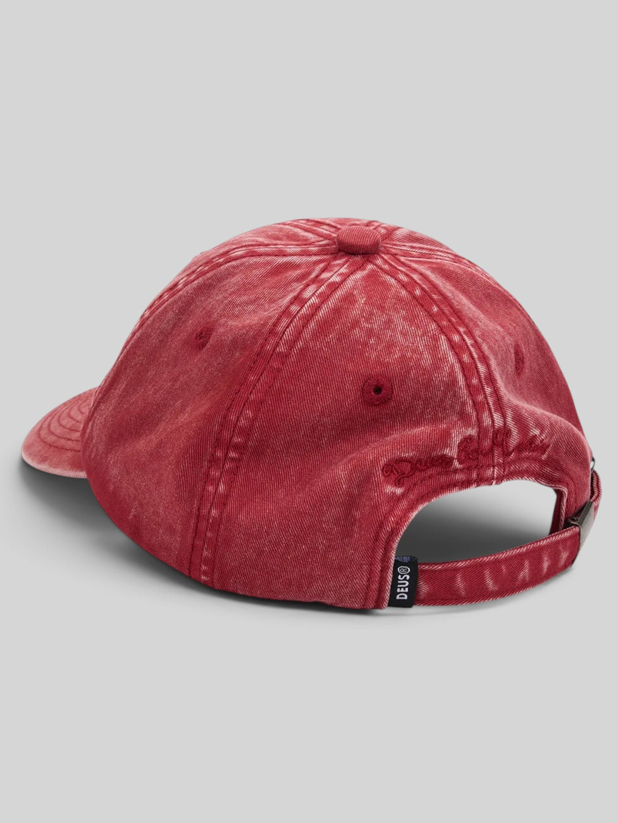 Baffle Haus Deus Shield dad cap in lava falls red cotton twill with a garment dyed and enzyme stone washed finish.