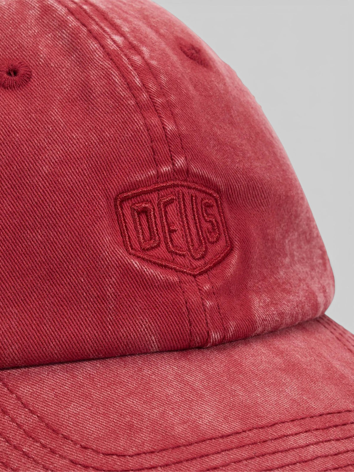 Baffle Haus Shield dad cap in lava falls red cotton twill with tonal embroidered Deus logo and enzyme stone wash