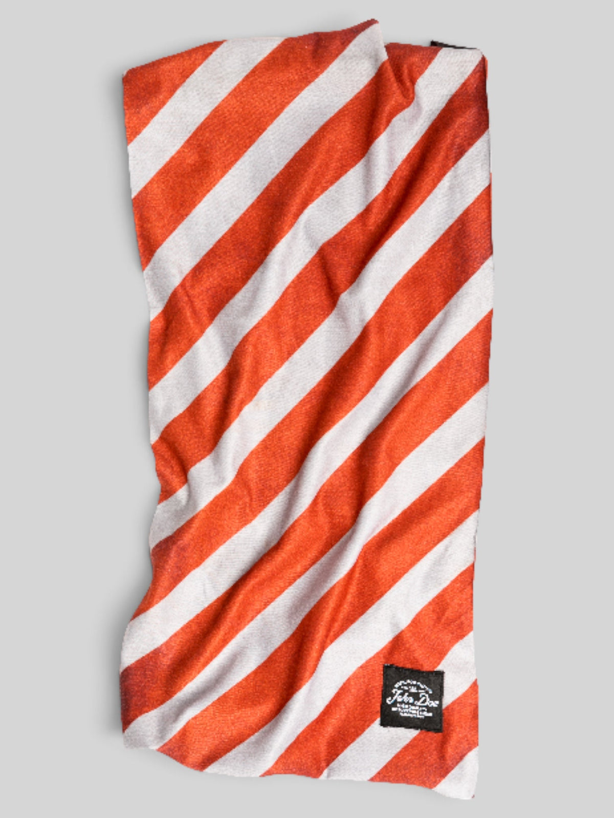Baffle Haus red and white striped seamless microfibre neck tube for sports and outdoor protection