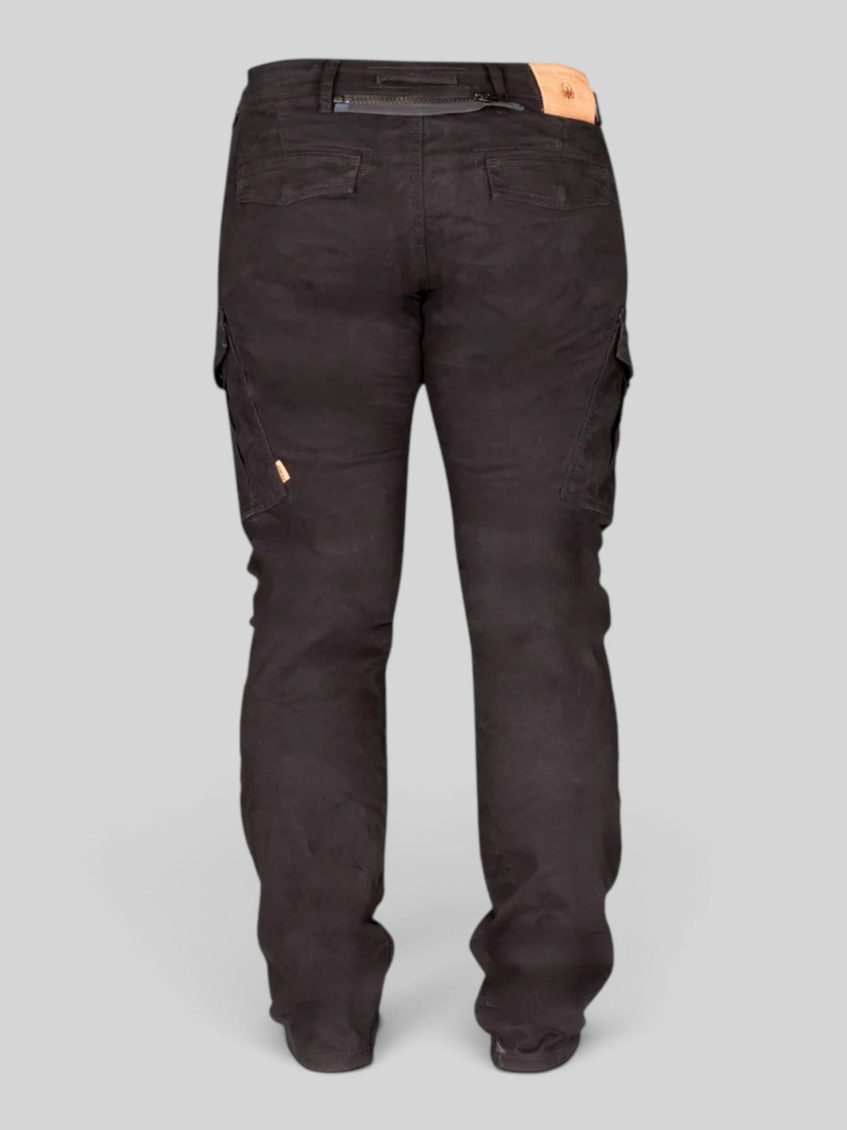 Rear view of Baffle Haus Remy 2 black brushed stretch denim cargo motorcycle jeans with leather belt patch