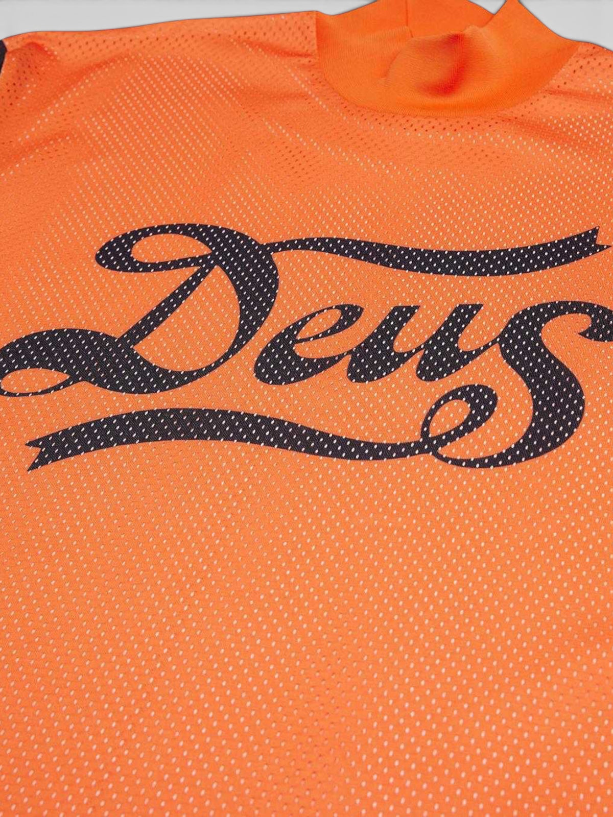 Baffle Haus Replay Moto Jersey in golden poppy orange polyester mesh with black Deus graphic on the chest
