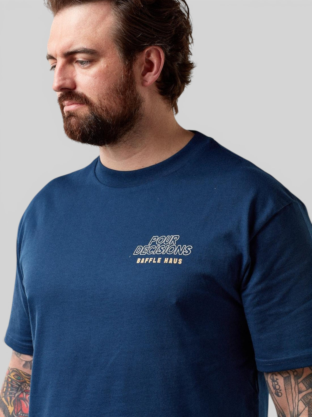 Baffle Haus Pour Decisions Coffee Club t-shirt in royal navy cotton with chest graphic on a male model