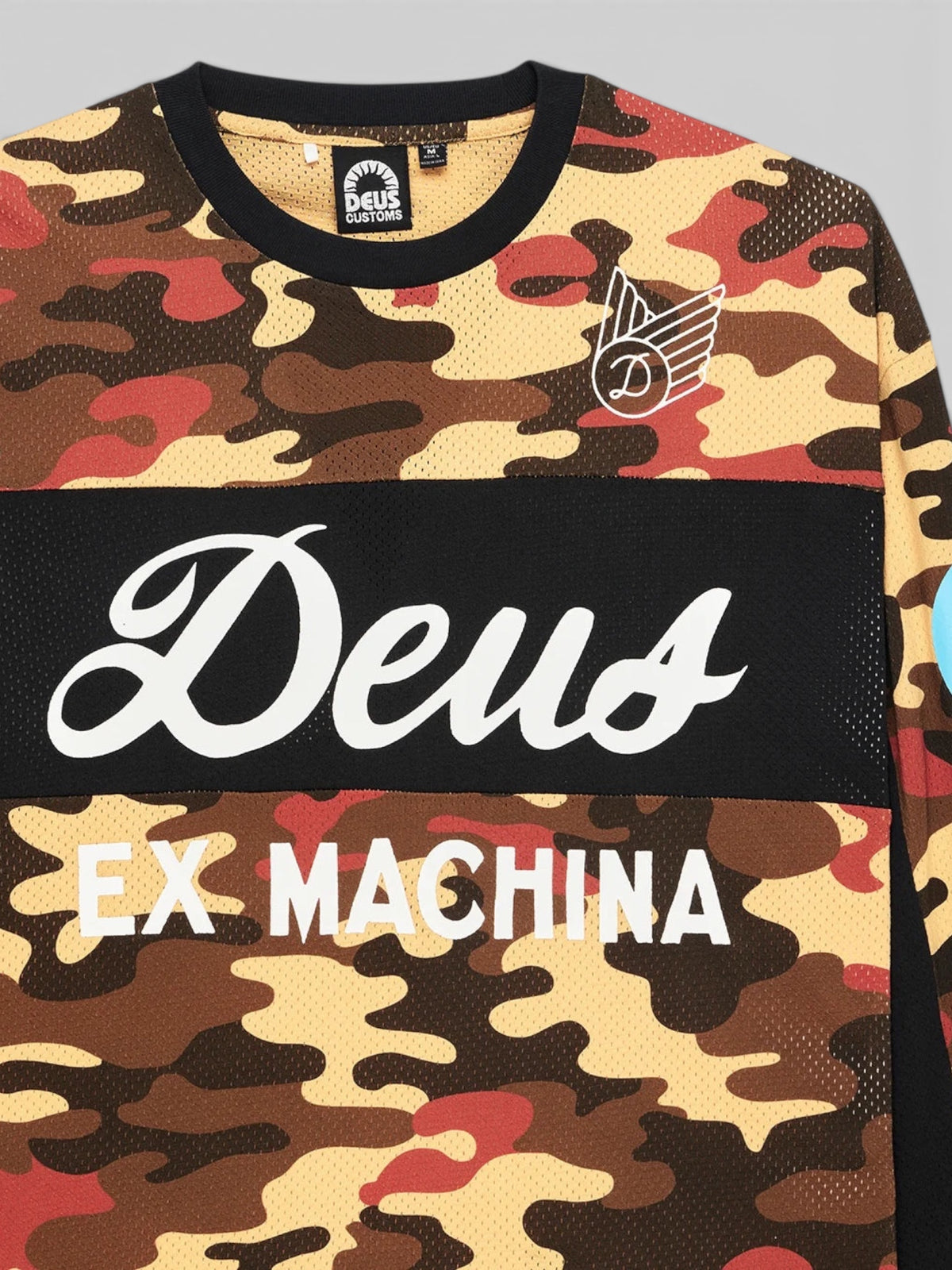 Baffle Haus Ombre Moto Jersey in rust camo recycled mesh with graphic chest prints and black contrast panels