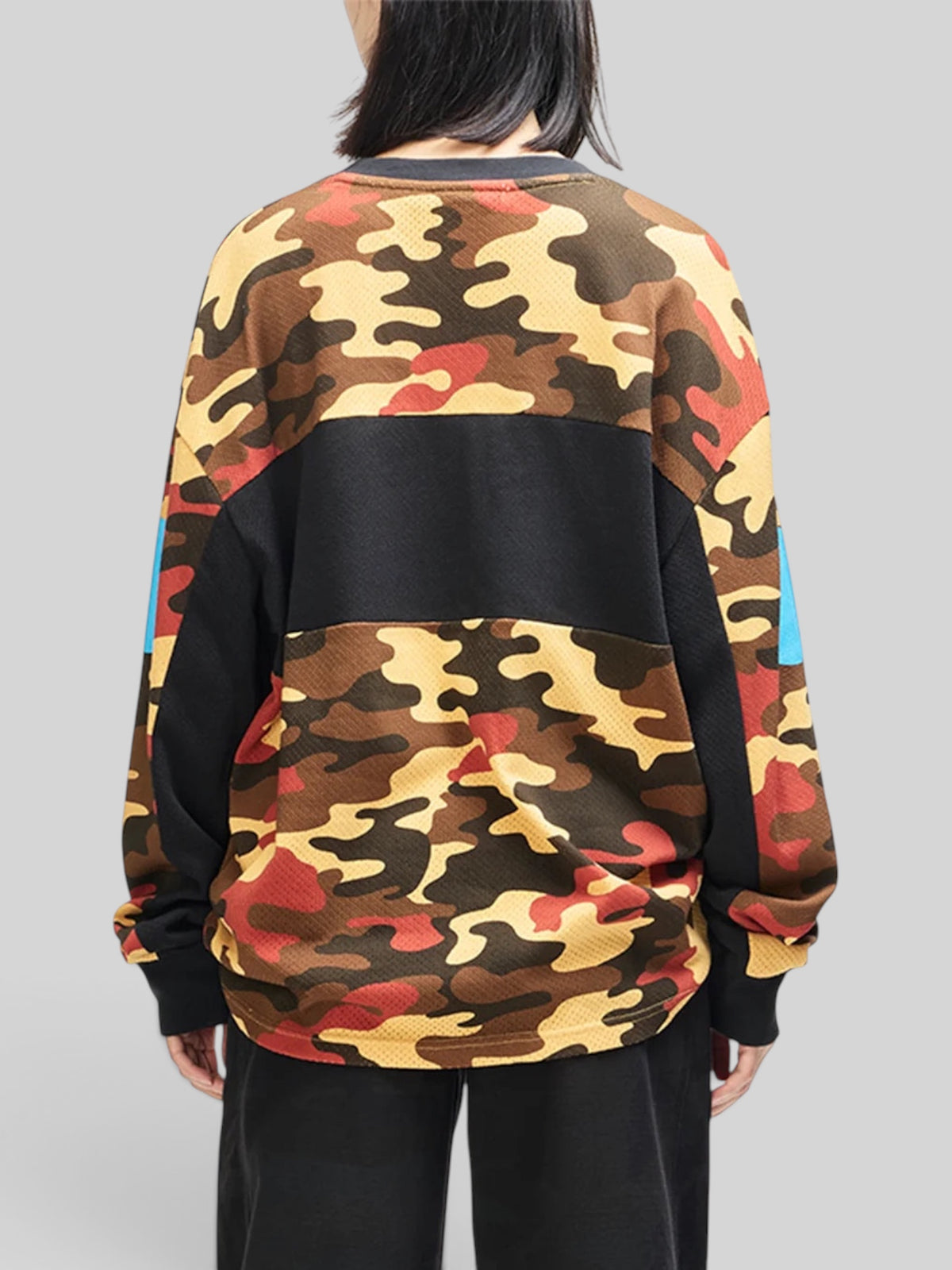 Baffle Haus Ombre Moto Jersey in rust camo print, featuring a loose fit, recycled polyester mesh, and back view.
