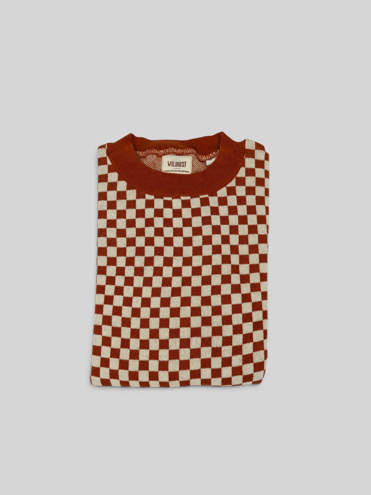 Baffle Haus vintage racing jumper in rust and cream with an all-over chequered pattern and ribbed mid-rise collar.