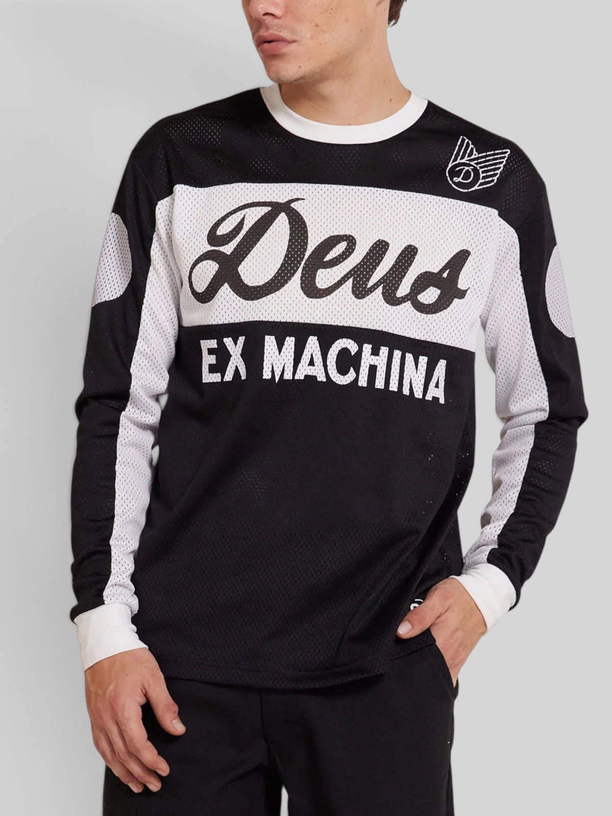 Baffle Haus Saber Moto Jersey in black and white polyester mesh with Deus Ex Machina branding and long sleeves