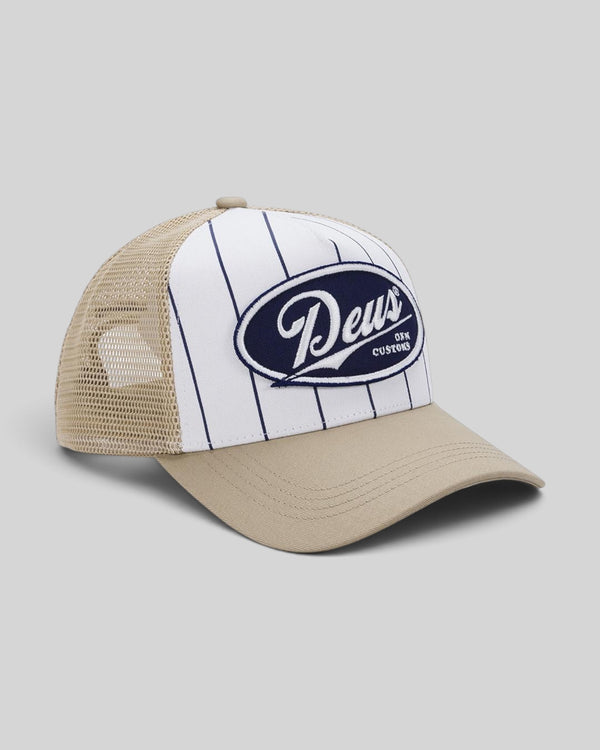 Baffle Haus Forecourt Trucker hat in safari featuring white pinstriped cotton twill, mesh back, and Deus patch.