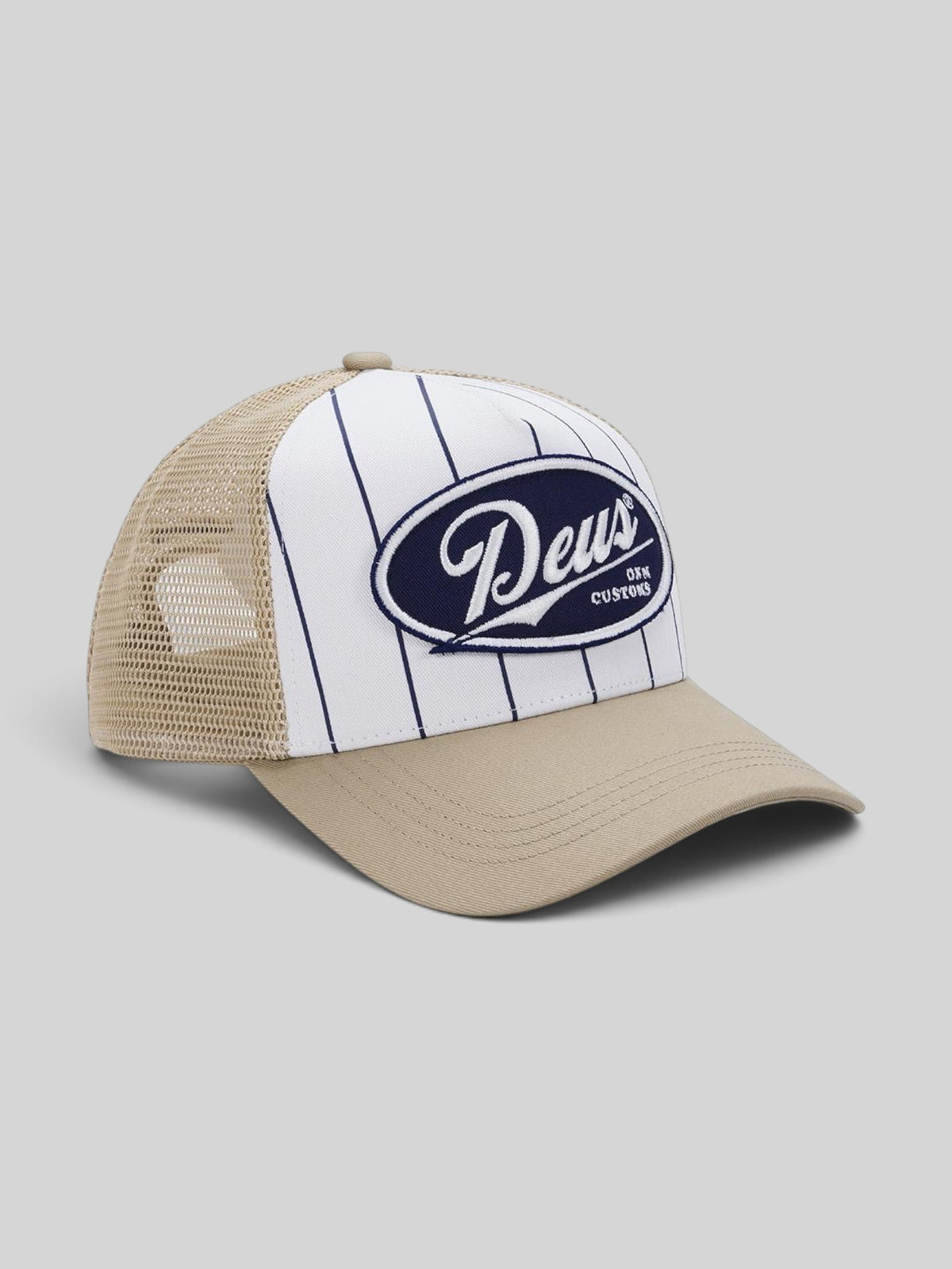 Baffle Haus Forecourt Trucker hat in safari featuring white pinstriped cotton twill, mesh back, and Deus patch.