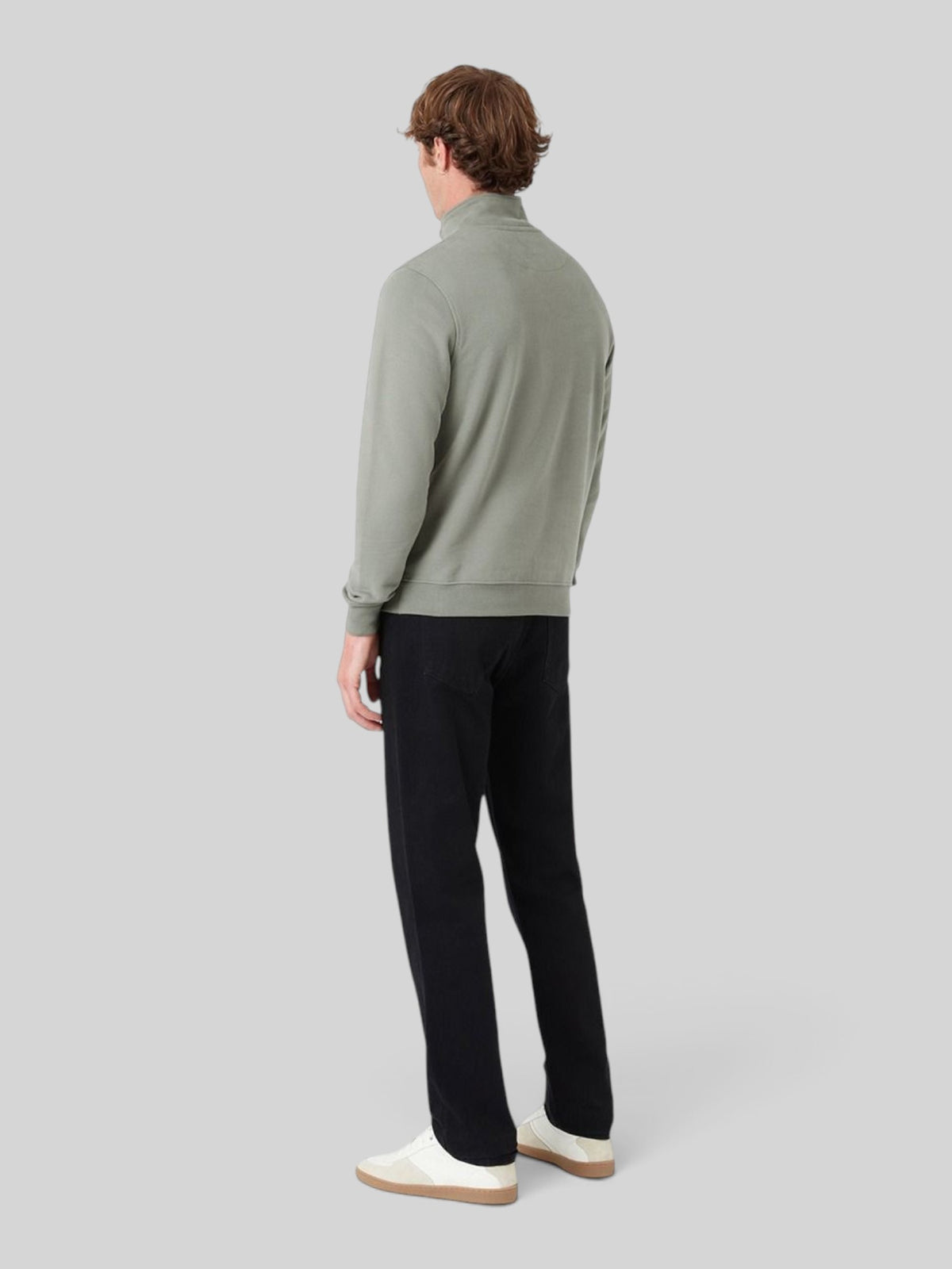 Baffle Haus sage green quarter zip cotton jersey sweatshirt worn by a man, back view showing relaxed fit.