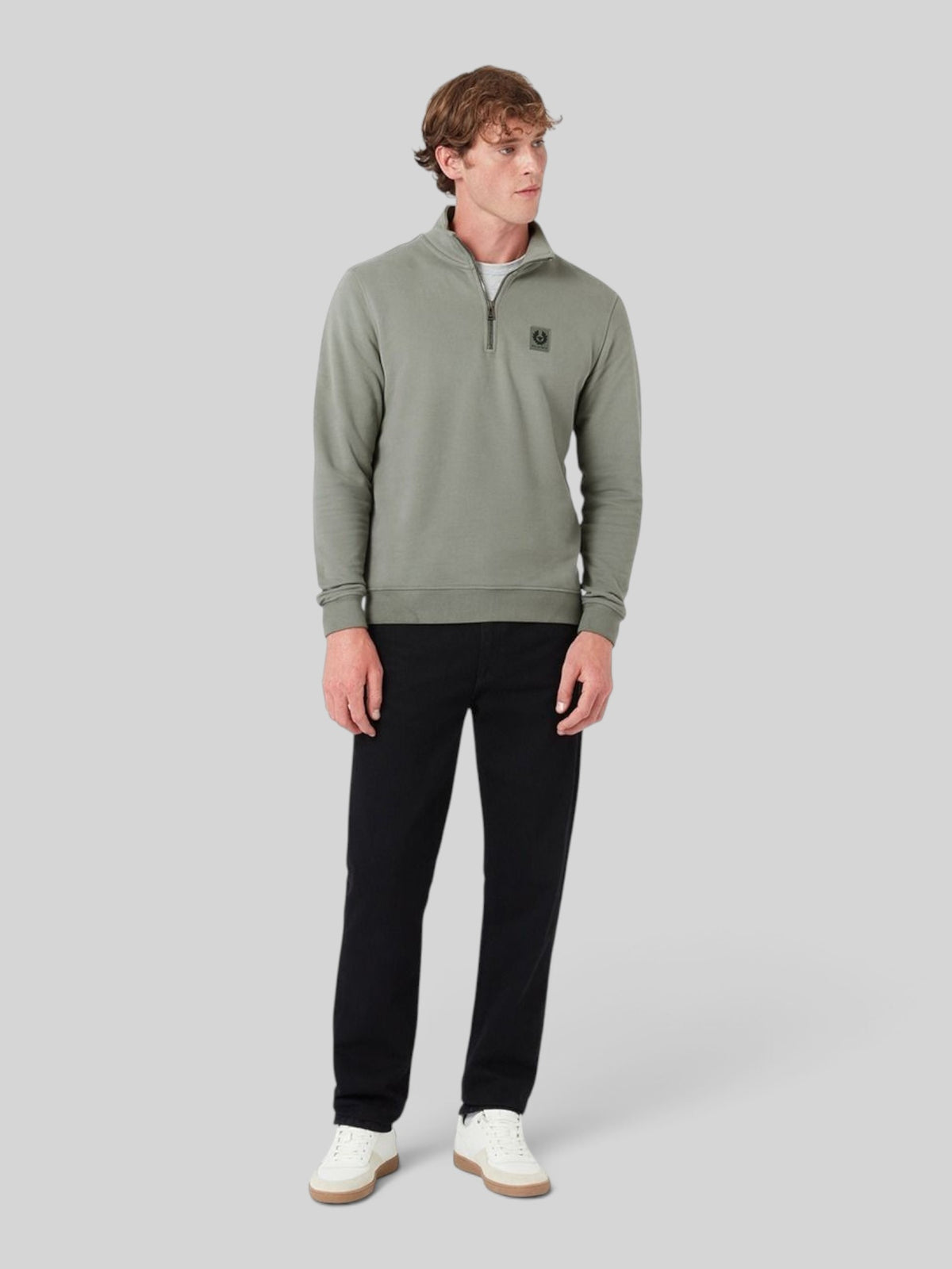 Baffle Haus sage green cotton quarter zip sweatshirt with chest pocket worn by a male model