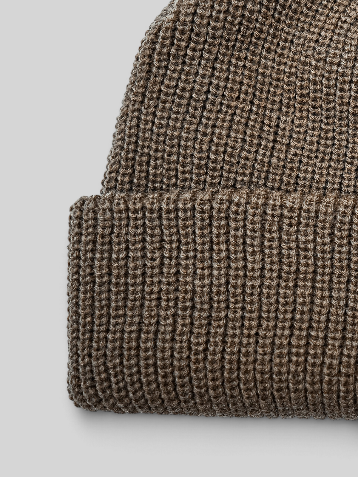 Baffle Haus sand coloured acrylic ribbed knit beanie with a classic cuffed design and woven brand label