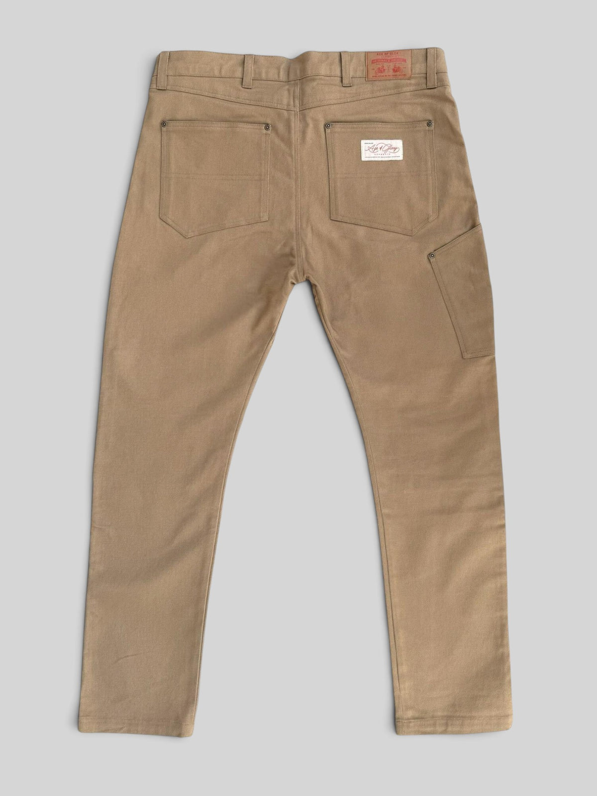 Baffle Haus Service Pants in desert khaki, a durable cotton-blend motorcycle trouser with a vintage carpenter style.